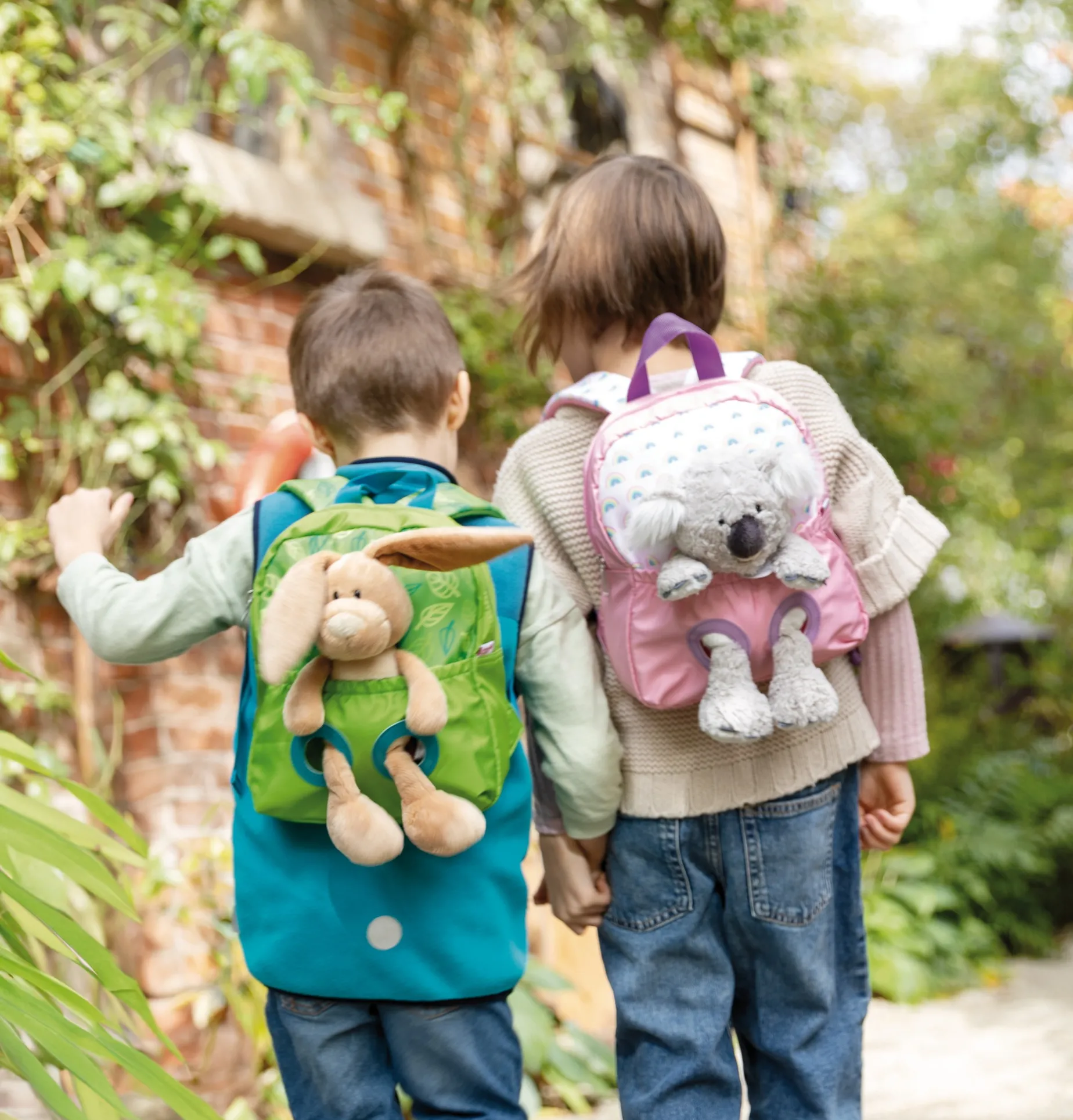 Green Backpack with soft toy rabbit