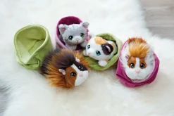 Grey striped soft toy cat in basket