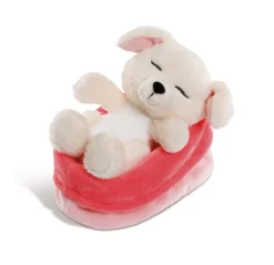 Cuddly toy dog in red-pink basket