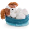 Soft toy puppy cocker spaniel sleeping in basket