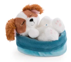 Soft toy puppy cocker spaniel sleeping in basket