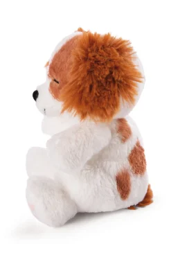 Soft toy puppy cocker spaniel sleeping in basket